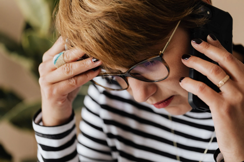 Man stressed calling on the phone