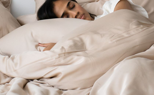 Girl sleeping on her bed