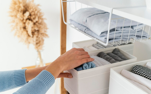 A person tidying up items