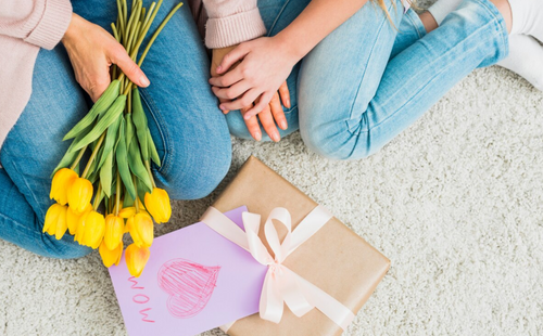 Gift box Mother day postcard near woman and girl