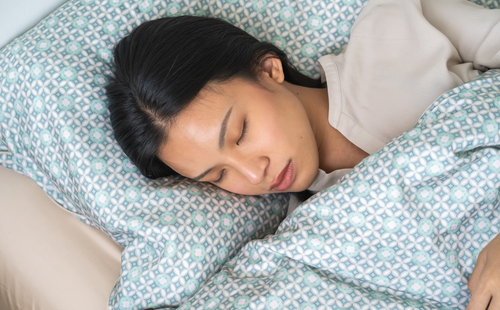 girl is sleeping on bed