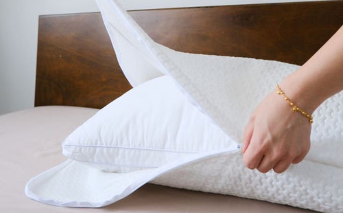 woman zipping weavve home's pillow protector