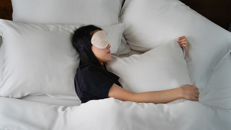 woman sleeping on bedsheets for sensitive skin