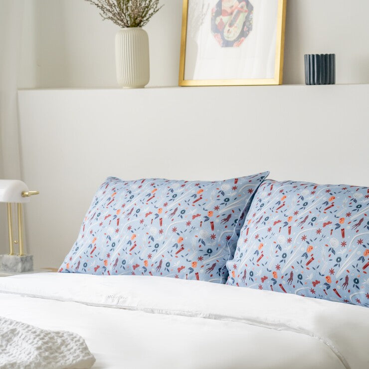 Weavve Home x SCENE SHANG Tencel Bed sheets collection singapore. Featuring SCENE SHANG Love is a Warm Brew print. TENCEL pillowcase pair in blue prints - Love is a Warm Brew print by SCENE SHANG. Shop tencel bed sheets online Singapore at Weavve Home.